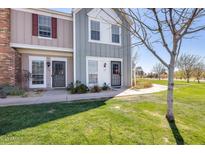Charming townhouse featuring manicured lawn and sidewalk leading to the entrance at 1600 N Saba St # 177, Chandler, AZ 85225