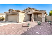 Charming single-Gathering home with a well-maintained front yard, desert landscaping, and a two-car garage at 18081 W Tasha Dr, Surprise, AZ 85388