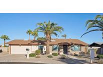 Charming single-story brick home featuring desert landscaping, and a well-manicured front yard at 2004 W Kristal Way, Phoenix, AZ 85027