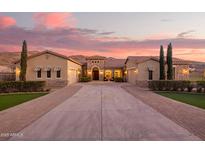Stunning home featuring a tile roof, stone accents, and a spacious driveway at 3211 E Ian Dr, Phoenix, AZ 85042