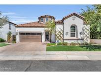 Charming stucco home featuring a tile roof, manicured landscaping, and a circular turret accent at 4639 N 29Th St, Phoenix, AZ 85016