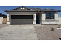 Charming single story home with a two car garage and desert landscaping at 481 N 17Th St, Coolidge, AZ 85128