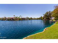 Beautiful waterfront property with lush landscaping and stunning views of the serene lake at 5200 S Lakeshore Dr # 106, Tempe, AZ 85283