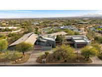 Aerial view of luxury property with desert landscaping and mountain views at 8845 E Sierra Pinta Dr, Scottsdale, AZ 85255