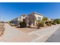 Inviting single-Gathering home featuring desert landscaping and a well-maintained lawn at 1474 E Elysian Pass, Queen Creek, AZ 85140