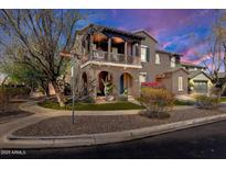Charming two-story home featuring a covered balcony and inviting curb appeal at 15260 W Alexandria Way, Surprise, AZ 85379