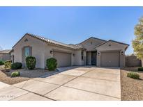 Charming single-story home features a three-car garage and well-maintained landscaping in a desirable neighborhood at 18369 W La Senda Dr, Surprise, AZ 85387