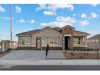 Charming single-story home features stone accents, neutral siding, and a well-maintained front yard at 35961 W San Ildefanso Ave, Maricopa, AZ 85138