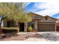 Inviting single-story house with a well-maintained front yard and attached garage at 42207 N 45Th Dr, Phoenix, AZ 85086