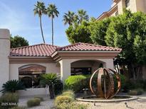 Beautiful building exterior featuring lush landscaping and a unique water feature and monument at 5104 N 32Nd St # 431, Phoenix, AZ 85018