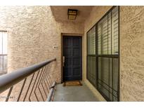 Inviting front door entrance with a welcome mat, and large windows providing natural light at 5122 N 31St Way # 238, Phoenix, AZ 85016