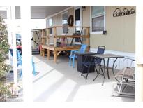Covered patio area with outdoor seating, perfect for relaxing and enjoying the outdoors at 7807 E Main St # D-32, Mesa, AZ 85207