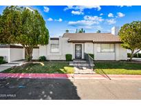 Charming single-story home featuring a well-maintained yard and secure front entry at 8742 E Via De La Luna --, Scottsdale, AZ 85258
