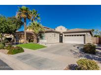 Charming single-story home featuring desert landscaping and a spacious three-car garage at 896 E Indian Wells Pl, Chandler, AZ 85249