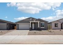 Charming single-story home with a two-car garage and neutral-toned exterior at 15769 W Beryl Ave, Waddell, AZ 85355