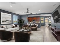 Beautiful living room with plush seating, modern decor, and an open concept design at 16430 W Alameda Rd, Surprise, AZ 85387