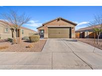 Charming single-story home with a two-car garage and low-maintenance landscaping on a sunny day at 3654 E Henson St, San Tan Valley, AZ 85140