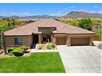Beautiful single-story home featuring a three-car garage, desert landscaping and gorgeous mountain views at 6044 E Hodges St, Cave Creek, AZ 85331