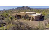 Lovely stucco home with desert landscaping and mountain views at 7603 E Soaring Eagle Way, Scottsdale, AZ 85266
