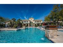 Beautiful community pool with stone pillar water features and inviting lounge areas at 16013 S Desert Foothills Pkwy # 1133, Phoenix, AZ 85048