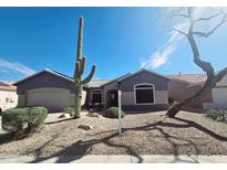 Charming home featuring desert landscaping, a tile roof, and a well-maintained yard at 21901 N Sonora Ln, Sun City West, AZ 85375