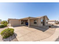 Exterior shot of the home with a covered carport, enhancing the property's practicality and curb appeal at 3301 S Goldfield Rd # 2034, Apache Junction, AZ 85119