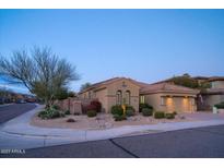 Charming home exterior with a well-manicured desert landscaped front yard, sidewalk, and two-car garage at 3634 E Sands Dr, Phoenix, AZ 85050