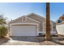 Charming single-story home with a two-car garage, desert landscaping and a new coat of exterior paint at 17406 N 28Th Dr, Phoenix, AZ 85053