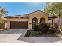 Charming single-story home with desert landscaping and a two-car garage at 4695 N 204Th Ave, Buckeye, AZ 85396