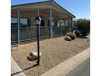 Charming single story home featuring a cozy front porch and low-maintenance landscaping at 11411 N 91St Ave # 175, Peoria, AZ 85345