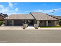 Beautiful, single-story home with a tile roof, a two-car garage, and a charming brick entryway at 1323 E Whalers Way, Tempe, AZ 85283