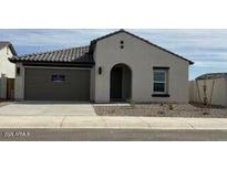 Charming single-story home featuring a neutral color palette, tile roof, and attached two-car garage at 36971 W Santa Maria St, Maricopa, AZ 85138