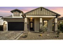 Charming single-Gathering home with a brick-accented facade and a well-manicured desert landscape at 8140 E June St, Mesa, AZ 85207
