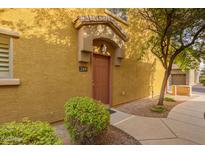 Charming townhome entrance featuring a covered porch and well-maintained landscaping at 17150 N 23Rd St # 249, Phoenix, AZ 85022