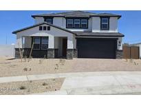 Beautiful two-story home with a modern design, a two car garage and stone accents at 10031 S 23Rd Dr, Phoenix, AZ 85041