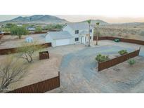 A two-story home featuring desert landscaping and an attached two car garage at 1819 W Joy Ranch Rd, Phoenix, AZ 85086