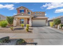 Charming two-story home with desert landscaping, two-car garage, and well-maintained front yard at 23290 N 175Th Ln, Surprise, AZ 85387