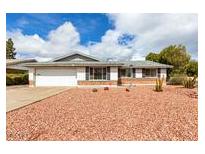 Charming single-story home featuring a two car garage and low maintenance desert landscaping in the front yard at 2540 E Riviera Dr, Tempe, AZ 85282