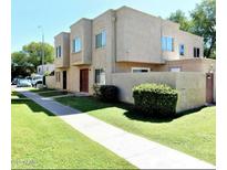 Two-story stucco home with walkway, lawn, and mature landscaping at 5420 W Lynwood St, Phoenix, AZ 85043