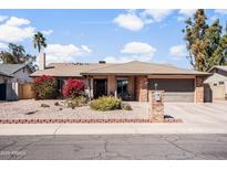 Charming single-story home with desert landscaping and a brick mailbox at 11820 S Half Moon Dr, Phoenix, AZ 85044