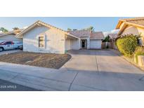 Charming single-story home featuring a desert landscape, driveway, and an attached garage at 1360 W Folley St, Chandler, AZ 85224