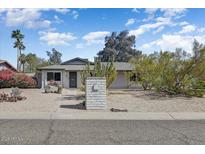 Charming single-story home featuring a desert landscaped front yard and brick mailbox at 17801 N 43Rd Way, Phoenix, AZ 85032