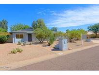 Charming single story home with desert landscaping and mature trees at 17801 N 43Rd Way, Phoenix, AZ 85032