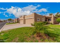 Charming single-story home featuring a two-car garage and a well-manicured lawn at 6001 E Southern Ave # 68, Mesa, AZ 85206