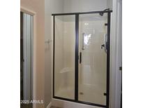 Walk-in shower with glass doors and convenient grab bar at 6001 E Southern Ave # 68, Mesa, AZ 85206