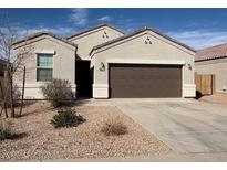 Charming single-story home featuring a well-maintained yard and a two-car garage at 1258 E Elaine St, Casa Grande, AZ 85122