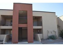 Attractive condo building featuring private patios and desert landscaping at 1340 N Recker Rd # 254, Mesa, AZ 85205