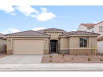 Inviting one-story home featuring a two-car garage and a tile roof at 17614 W Rancho Dr, Litchfield Park, AZ 85340