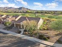 Beautiful single-Gathering home with desert landscaping, tile roof, and golf course views at 26853 W Marco Polo Rd, Buckeye, AZ 85396