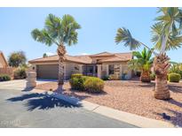 Beautiful desert landscaping and a charming facade define this single-story home at 3245 N 147Th Ln, Goodyear, AZ 85395